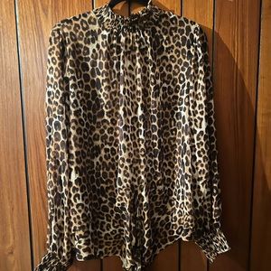 Express- sheer, long sleeve, tie front, two button, elastic neck closure. Sz.XL